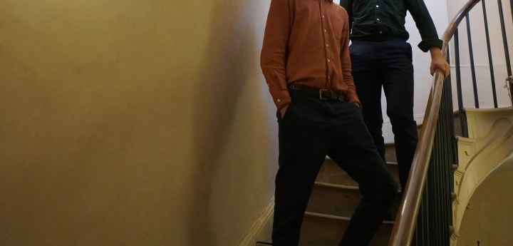 Two guitarists in a stairwell